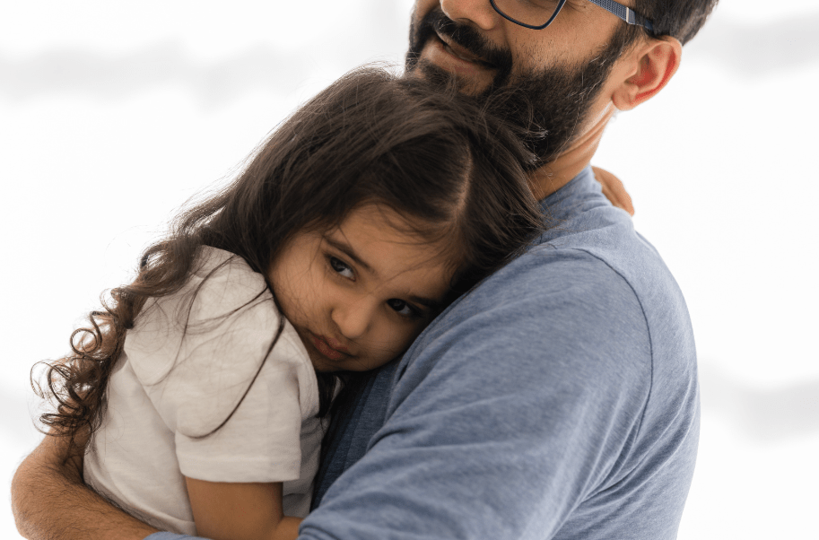 Child showing anxious tendencies with father.